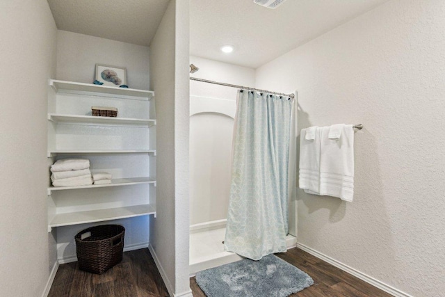 759 Ocelot Ct, Seguin, TX 78155 - bathroom featuring wood finished floors and a stall shower