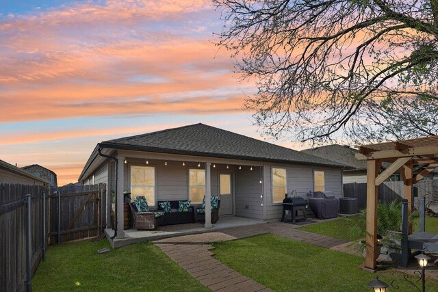 759 Ocelot Ct, Seguin, TX 78155 - back of property featuring an outdoor living space, a patio, a fenced backyard, and roof with shingles