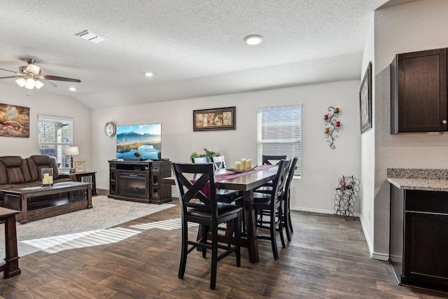 759 Ocelot Ct, Seguin, TX 78155 - dining area featuring a ceiling fan, dark wood-style flooring, a textured ceiling, vaulted ceiling, and recessed lighting