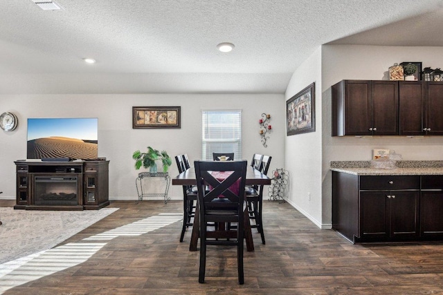 759 Ocelot Ct, Seguin, TX 78155 - dining area featuring dark wood-style floors, a textured ceiling, and recessed lighting