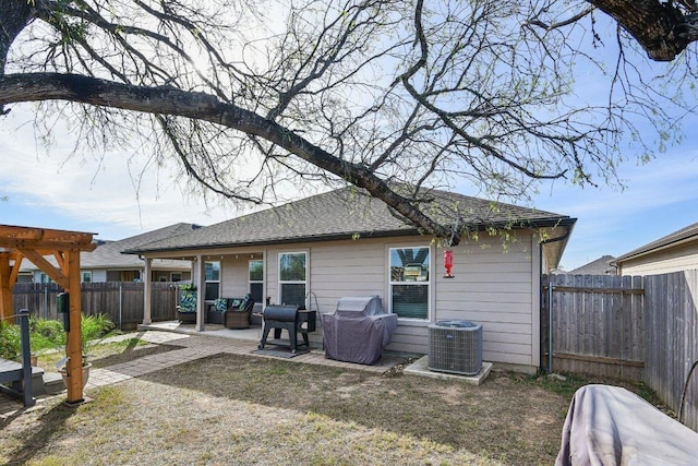 759 Ocelot Ct, Seguin, TX 78155 - back of property featuring a fenced backyard, a patio, and roof with shingles
