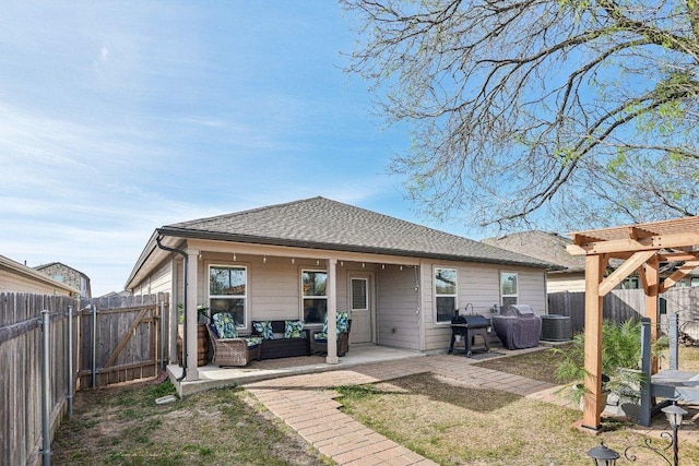 759 Ocelot Ct, Seguin, TX 78155 - rear view of house with an outdoor hangout area, a fenced backyard, a patio area, a gate, and a shingled roof