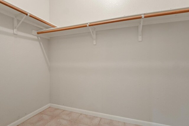 walk in closet featuring light tile patterned floors