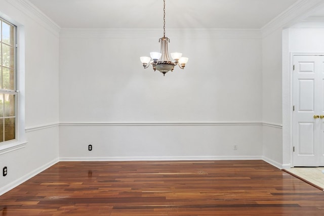 1103 Vanderbilt Cir, Pflugerville, TX 78660 - unfurnished dining area featuring a chandelier, wood finished floors, and crown molding