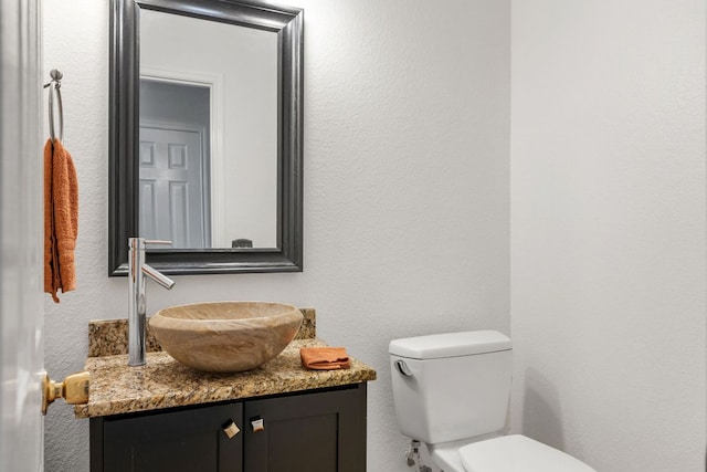 1103 Vanderbilt Cir, Pflugerville, TX 78660 - half bath with vanity and a textured wall