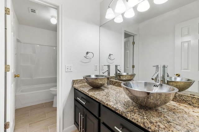 1103 Vanderbilt Cir, Pflugerville, TX 78660 - bathroom with double vanity and  shower combination