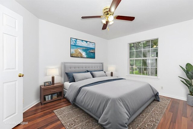 1103 Vanderbilt Cir, Pflugerville, TX 78660 - bedroom with dark wood finished floors and a ceiling fan
