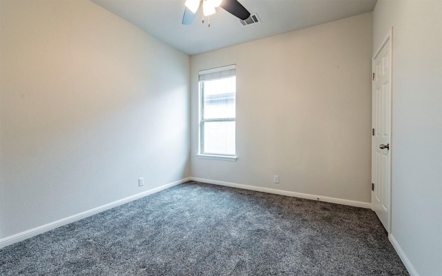 carpeted spare room featuring a ceiling fan, baseboards, and visible vents