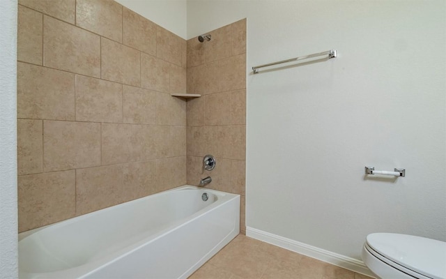 bathroom featuring baseboards, toilet, tile patterned floors, and bathing tub / shower combination