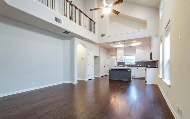 kitchen featuring dark wood finished floors, ceiling fan, and visible vents