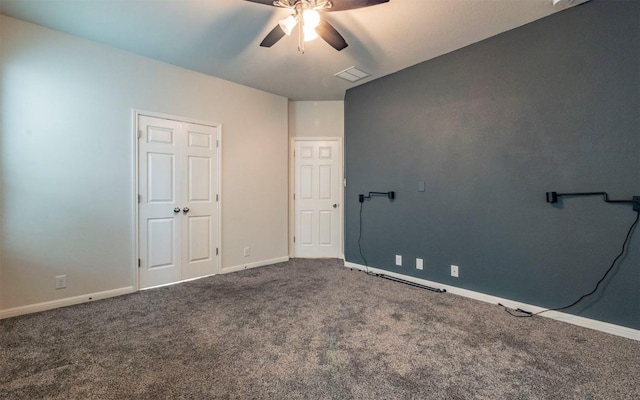unfurnished bedroom with a ceiling fan, carpet, and baseboards
