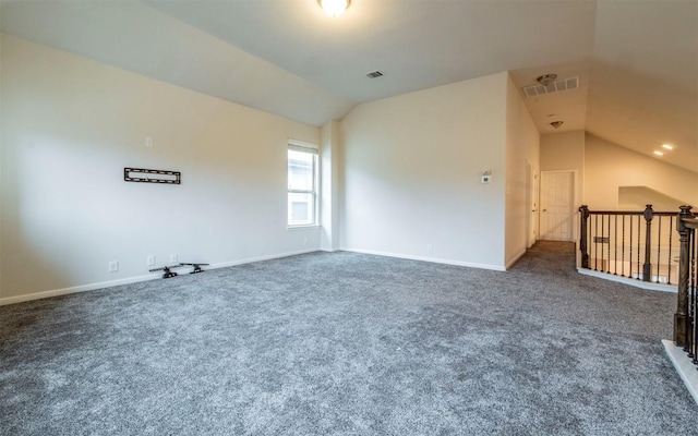 7337 Menchaca Rd Unit 31, Austin, TX 78745 - carpeted empty room featuring vaulted ceiling and baseboards