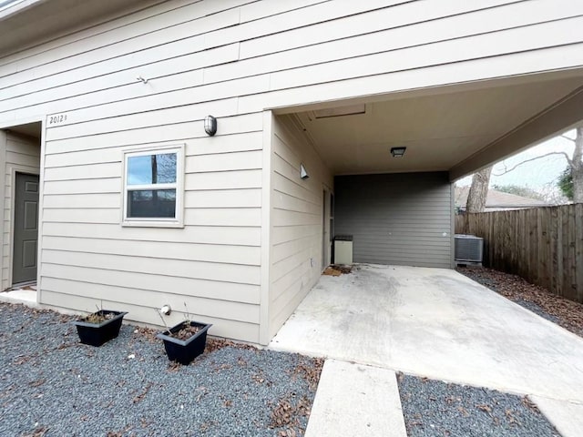 2012 Willow St Unit B, Austin, TX 78702 - view of side of home featuring central AC and an attached carport
