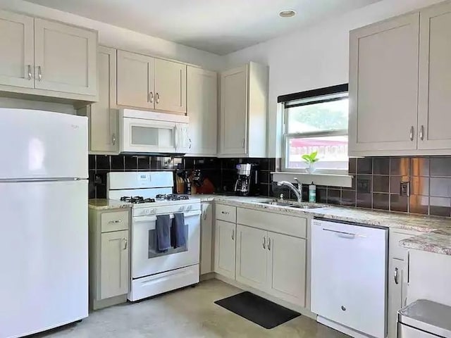 2012 Willow St Unit B, Austin, TX 78702 - kitchen with white appliances, a sink, backsplash, light stone countertops, and recessed lighting