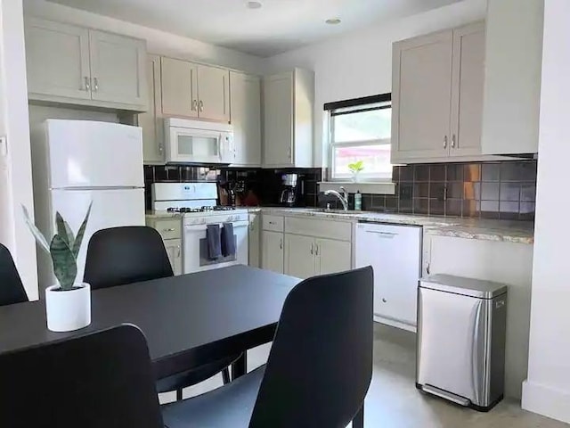 2012 Willow St Unit B, Austin, TX 78702 - kitchen featuring white appliances, backsplash, and a sink