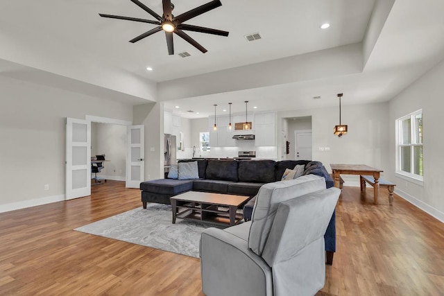 414 Wesley Ridge Dr, Spicewood, TX 78669 - living area with light wood-type flooring, ceiling fan, and recessed lighting