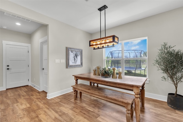 414 Wesley Ridge Dr, Spicewood, TX 78669 - dining space featuring light wood-style flooring and a chandelier