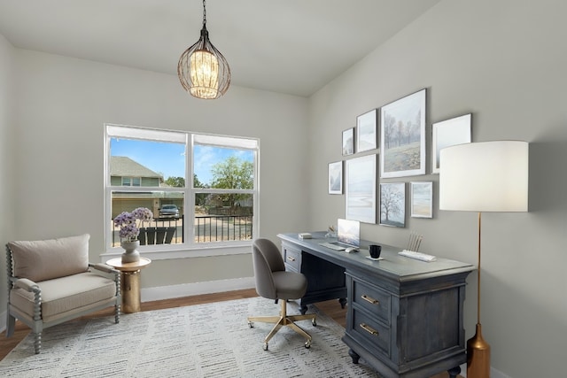 414 Wesley Ridge Dr, Spicewood, TX 78669 - office space featuring wood finished floors and a chandelier