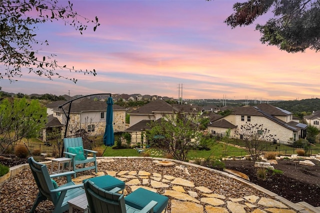 308 Highland Village Cv, Austin, TX 78738 - patio terrace at dusk featuring a residential view and a patio area