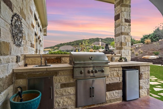 308 Highland Village Cv, Austin, TX 78738 - patio terrace at dusk featuring a sink