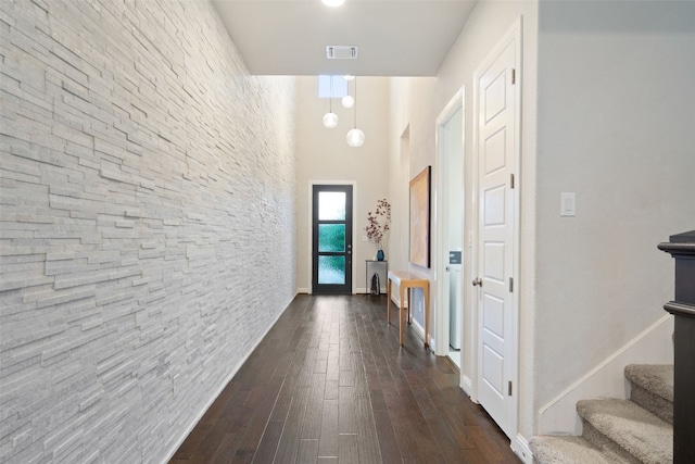 308 Highland Village Cv, Austin, TX 78738 - hallway featuring dark wood-style floors, a high ceiling, and stairs