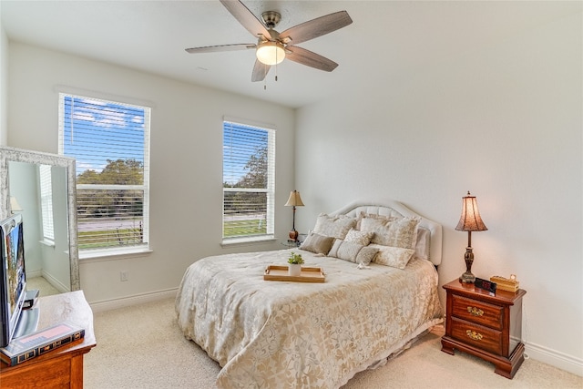 334 Sapling Dr, Driftwood, TX 78619 - bedroom with multiple windows, light carpet, and ceiling fan