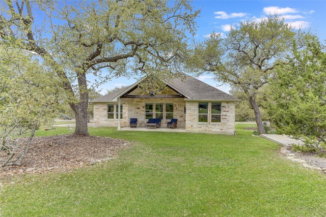 334 Sapling Dr, Driftwood, TX 78619 - rear view of property with stone siding, a lawn, a patio, and a shingled roof