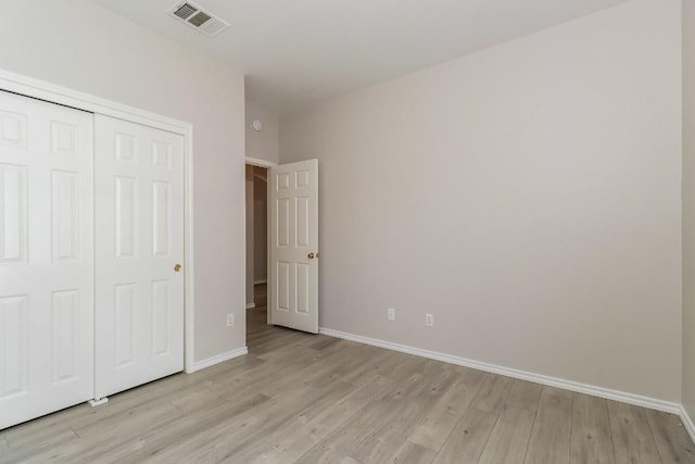11817 Bastrop St, Manor, TX 78653 - unfurnished bedroom featuring light wood-style floors and a closet