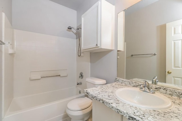 bathroom with toilet, vanity, and shower / bathing tub combination