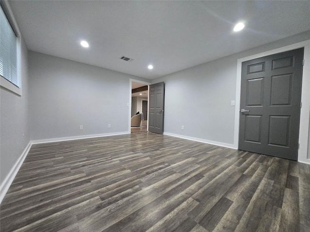 507 W 1st St, Flatonia, TX 78941 - spare room featuring dark wood-type flooring and recessed lighting