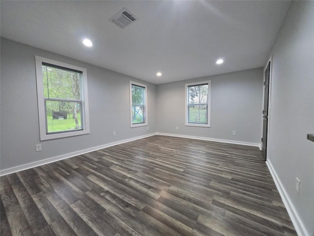 507 W 1st St, Flatonia, TX 78941 - spare room with dark wood-style floors and recessed lighting