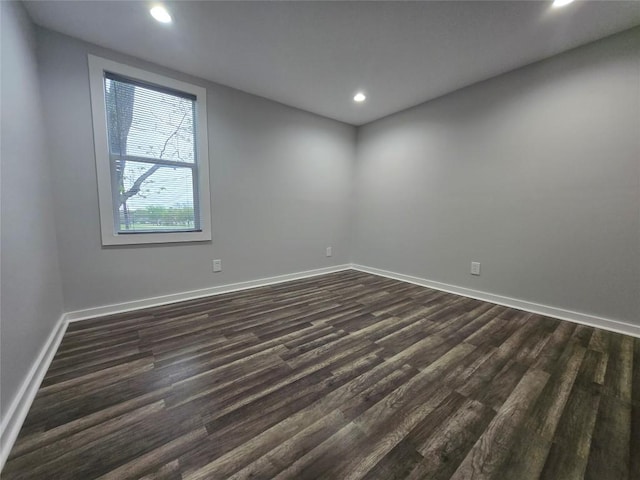 507 W 1st St, Flatonia, TX 78941 - spare room featuring dark wood-style flooring and recessed lighting