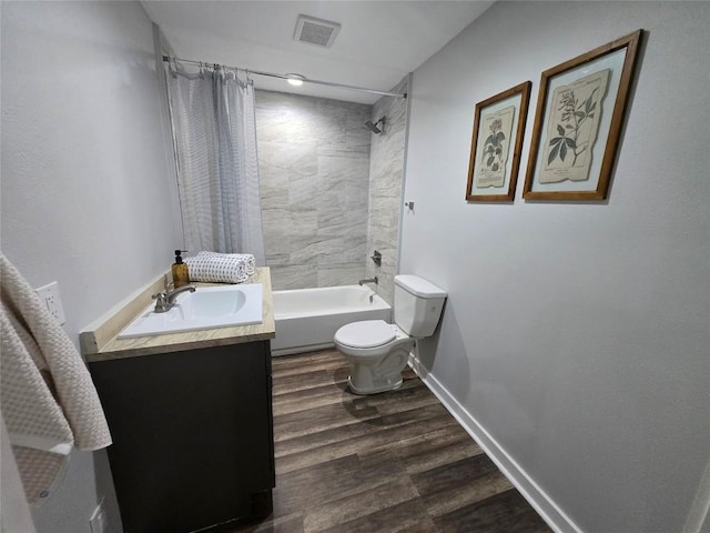 507 W 1st St, Flatonia, TX 78941 - bathroom featuring vanity, shower / bath combo with shower curtain, and wood finished floors
