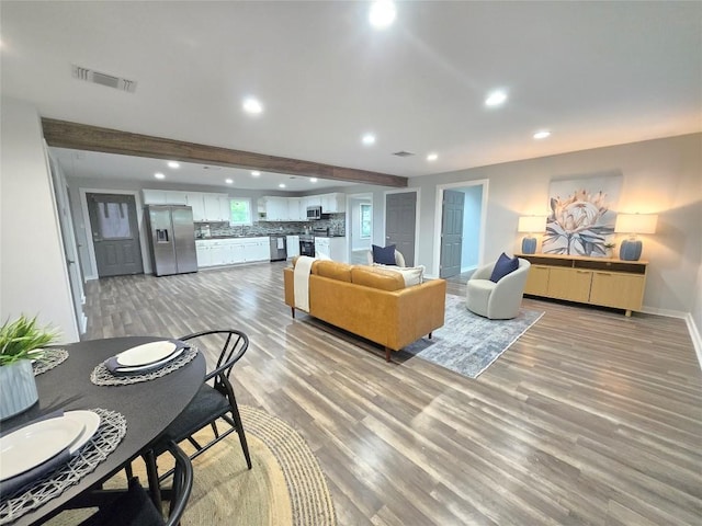 507 W 1st St, Flatonia, TX 78941 - living area with recessed lighting, light wood-style flooring, and beamed ceiling