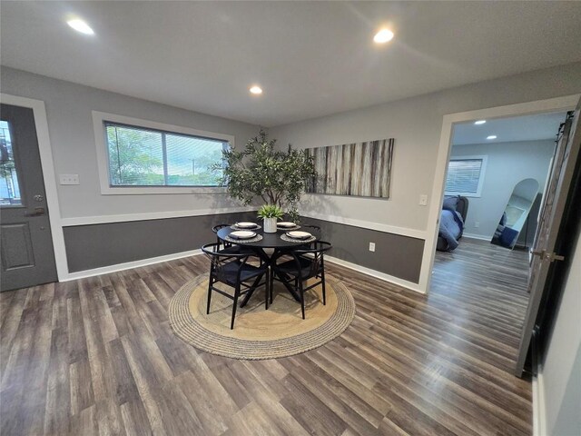 507 W 1st St, Flatonia, TX 78941 - dining area featuring recessed lighting, wood finished floors, and arched walkways