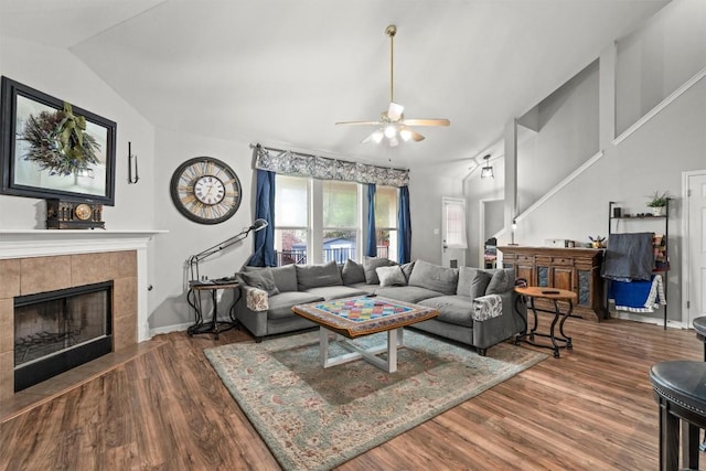 2319 Rock Ledge Dr, Georgetown, TX 78626 - living area featuring lofted ceiling, a ceiling fan, wood finished floors, and a fireplace