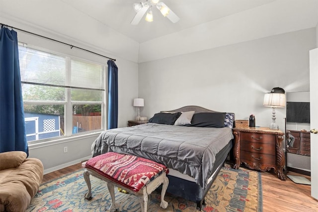 2319 Rock Ledge Dr, Georgetown, TX 78626 - bedroom with light wood-style flooring, multiple windows, and ceiling fan