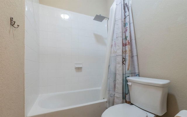 8021 Arezzo Dr, Round Rock, TX 78665 - full bath featuring toilet, a textured wall, and shower / bath combo with shower curtain