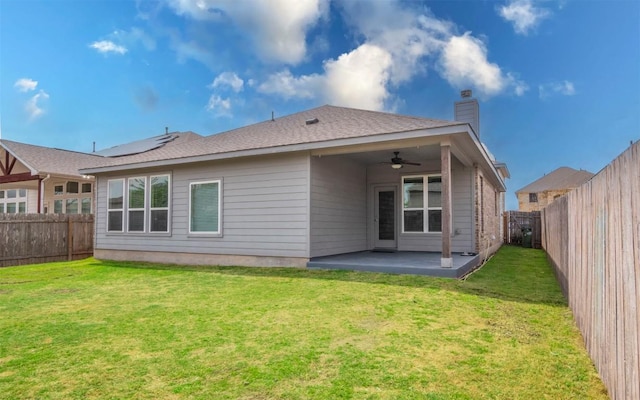 8021 Arezzo Dr, Round Rock, TX 78665 - rear view of property featuring ceiling fan, a patio area, and a chimney