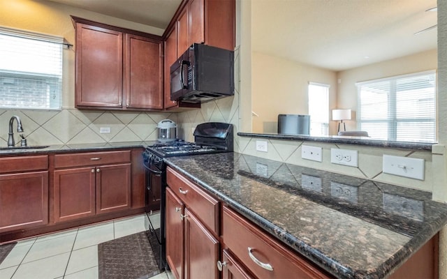 8021 Arezzo Dr, Round Rock, TX 78665 - kitchen featuring black appliances, a sink, tasteful backsplash, and dark brown cabinets