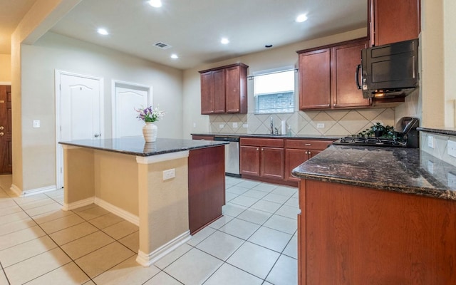 8021 Arezzo Dr, Round Rock, TX 78665 - kitchen featuring black microwave, stainless steel dishwasher, a sink, decorative backsplash, and light tile patterned floors
