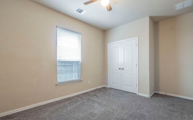 8021 Arezzo Dr, Round Rock, TX 78665 - unfurnished bedroom featuring carpet flooring, a closet, baseboards, and a ceiling fan
