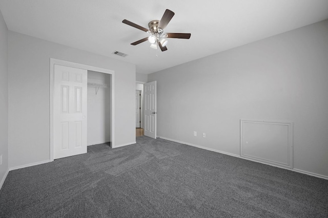 720 Northcreek Blvd, Leander, TX 78641 - unfurnished bedroom with dark carpet, a ceiling fan, and a closet