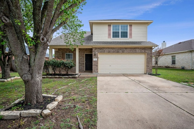 720 Northcreek Blvd, Leander, TX 78641 - view of front of home featuring an attached garage, brick siding, concrete driveway, a front yard, and a shingled roof