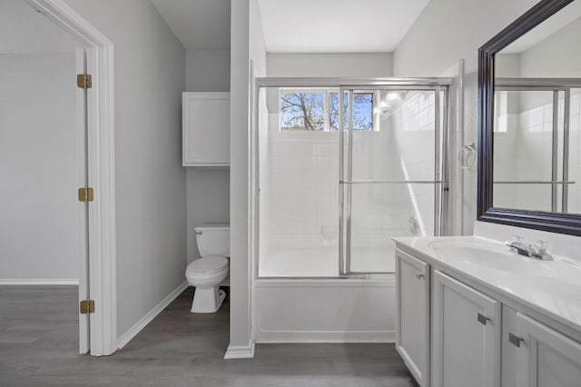 720 Northcreek Blvd, Leander, TX 78641 - full bathroom with vanity, combined bath / shower with glass door, and wood finished floors