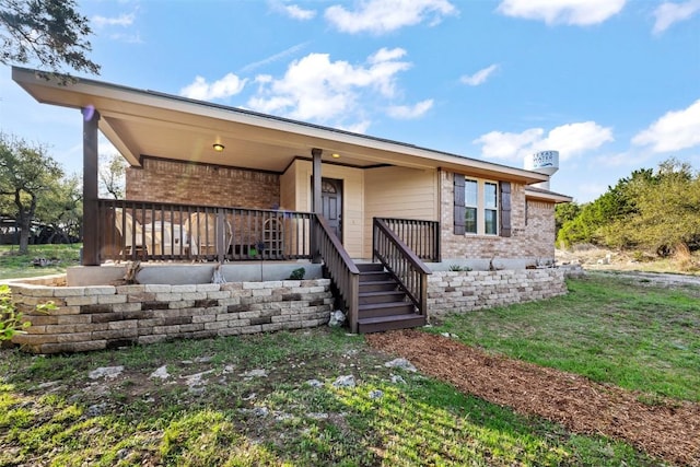 1135 Twisted Oak Ct, Canyon Lake, TX 78133 - view of front of home featuring brick siding and covered porch