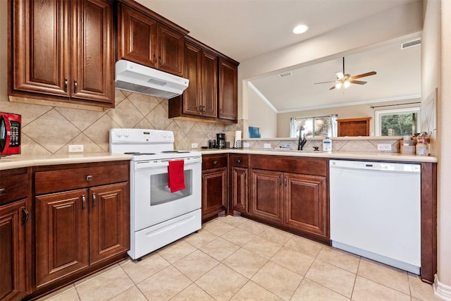 1135 Twisted Oak Ct, Canyon Lake, TX 78133 - kitchen featuring white appliances, under cabinet range hood, a ceiling fan, light countertops, and backsplash