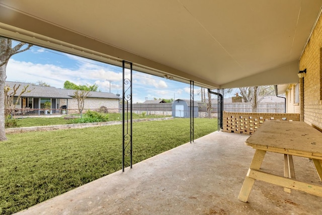 307 S 7th St, Pflugerville, TX 78660 - view of patio featuring an outdoor structure, fence, and a storage shed