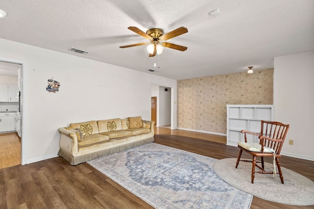 307 S 7th St, Pflugerville, TX 78660 - living area featuring visible vents, wood finished floors, ceiling fan, and a textured ceiling