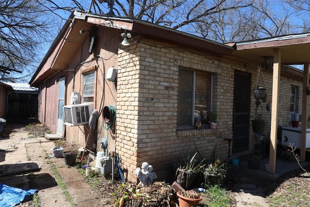 110 Hergotz Ln, Austin, TX 78742 - view of side of property featuring cooling unit and brick siding